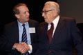 John Wright shakes hands with Henry Kissinger