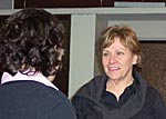 Margaret Drain chats with an Institute student.